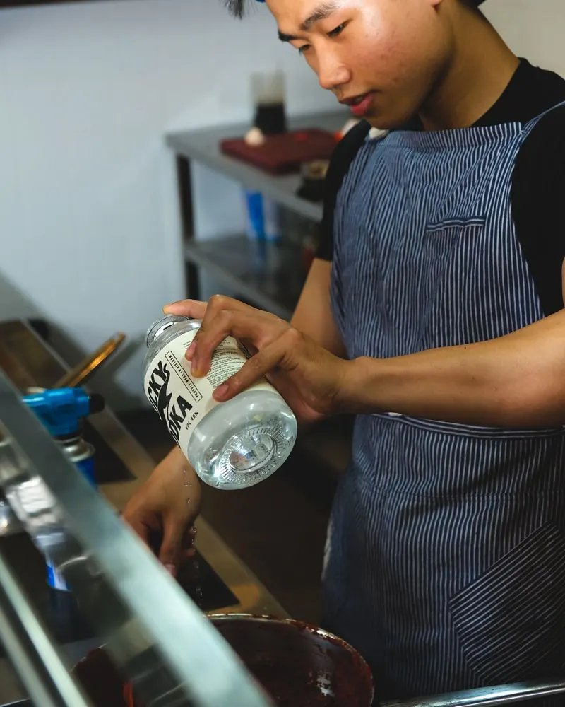 A bartender pouring Lucky Vodka