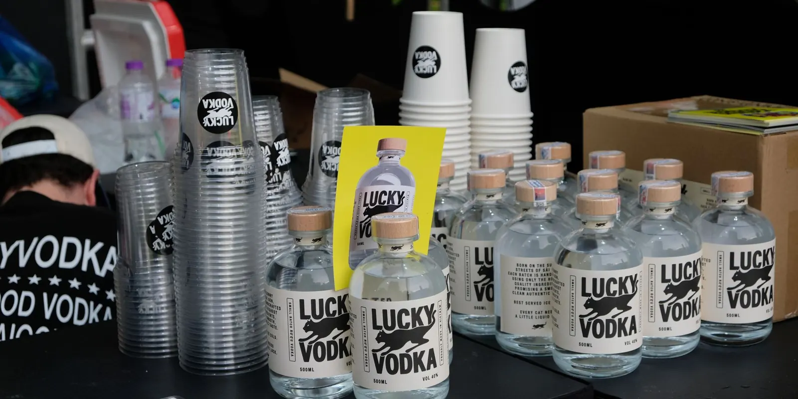 Lucky Vodka bottles lined up at an event bar